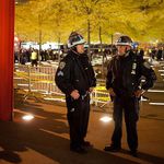 Two NYPD officers confer last night